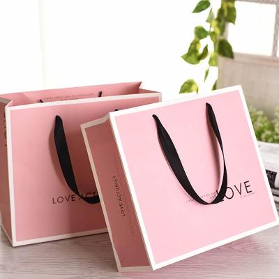 pink paper clothing shopping bag